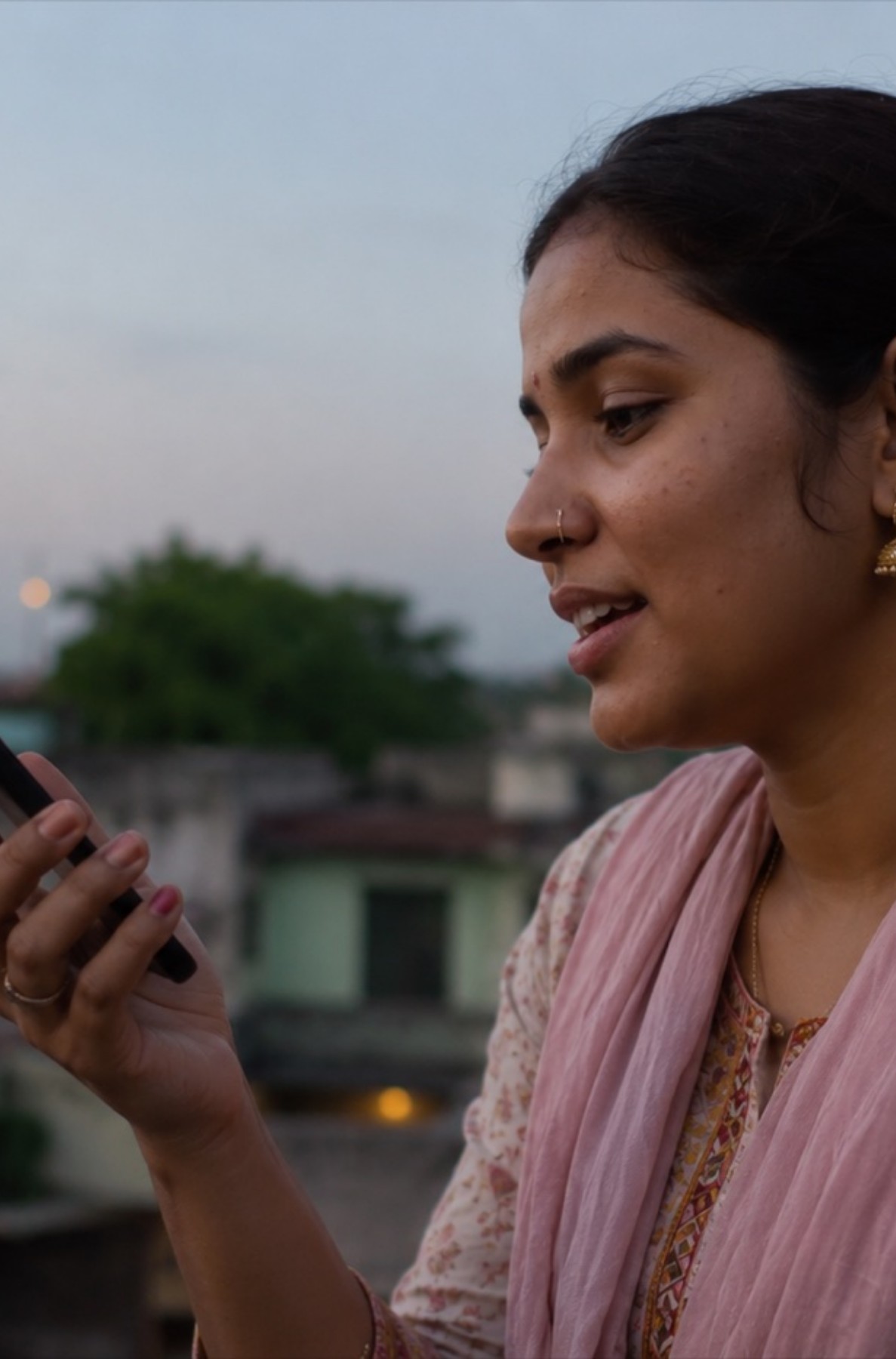Woman speaking to her phone